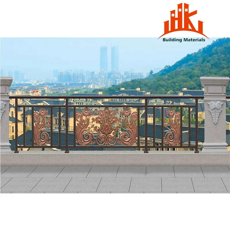 Ornate copper-colored metal railing panels installed on an outdoor terrace with a city view