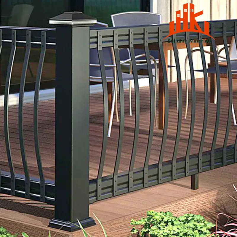 Wavy black metal railing with a post installed on an outdoor wooden deck