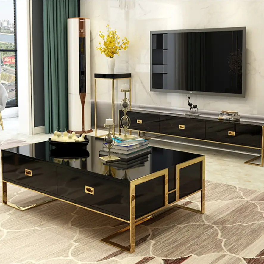 Modern living room with a glossy black coffee table and TV stand featuring gold metal accents
