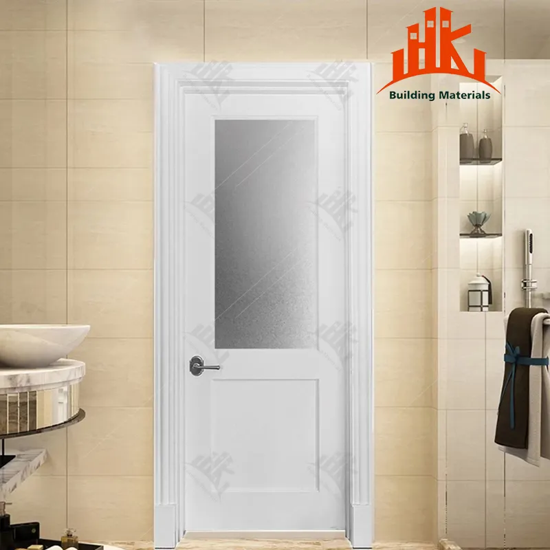White interior door with frosted glass panel in a bathroom setting