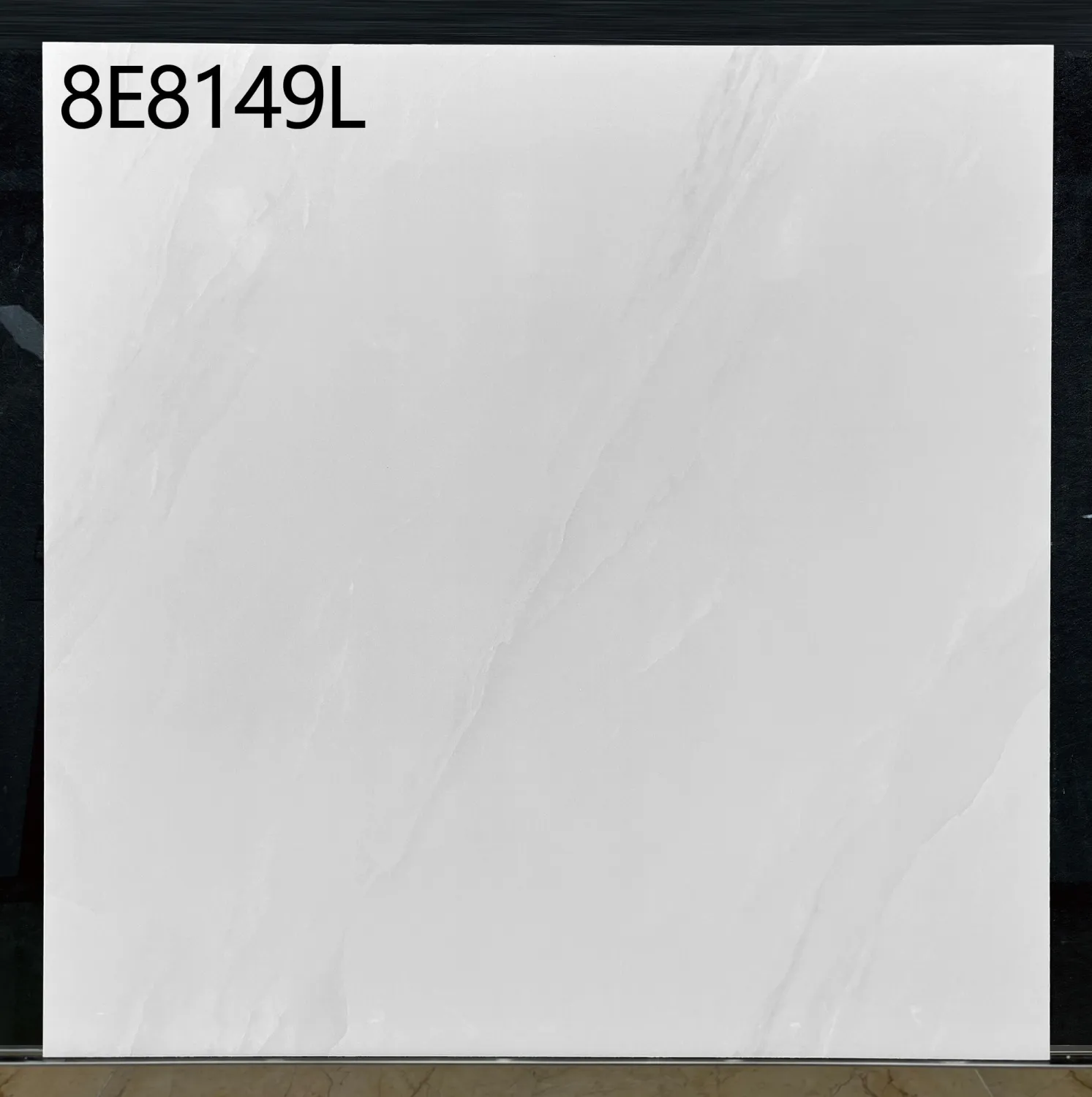 White square tile with a faint diagonal marble pattern and SKU code 8E8149L in the corner