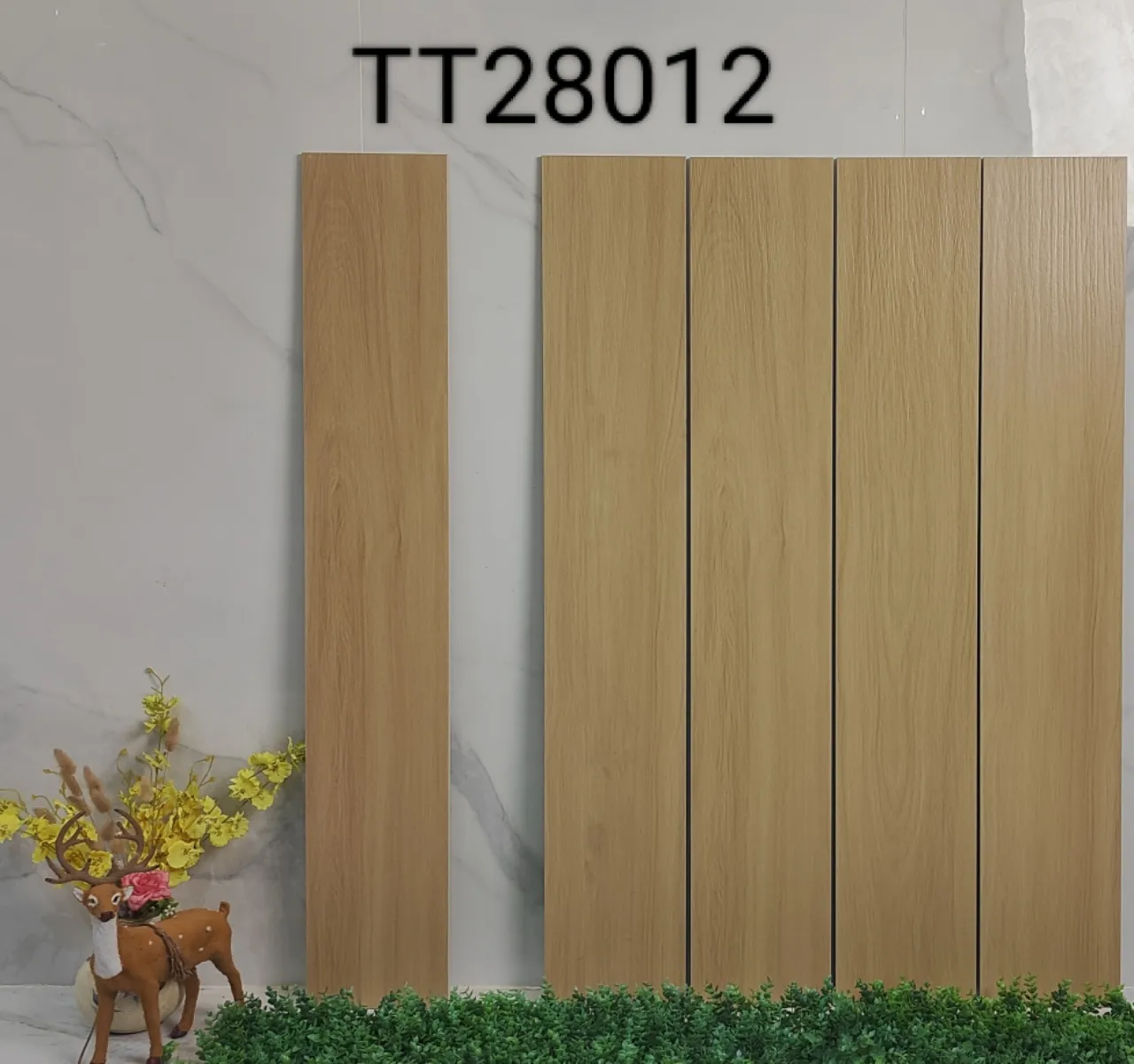 Wood-look ceramic tiles, model TT28012, arranged on a wall.