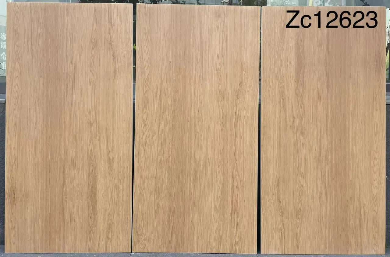 Three light oak wood effect tiles arranged side by side with model number Zc12623