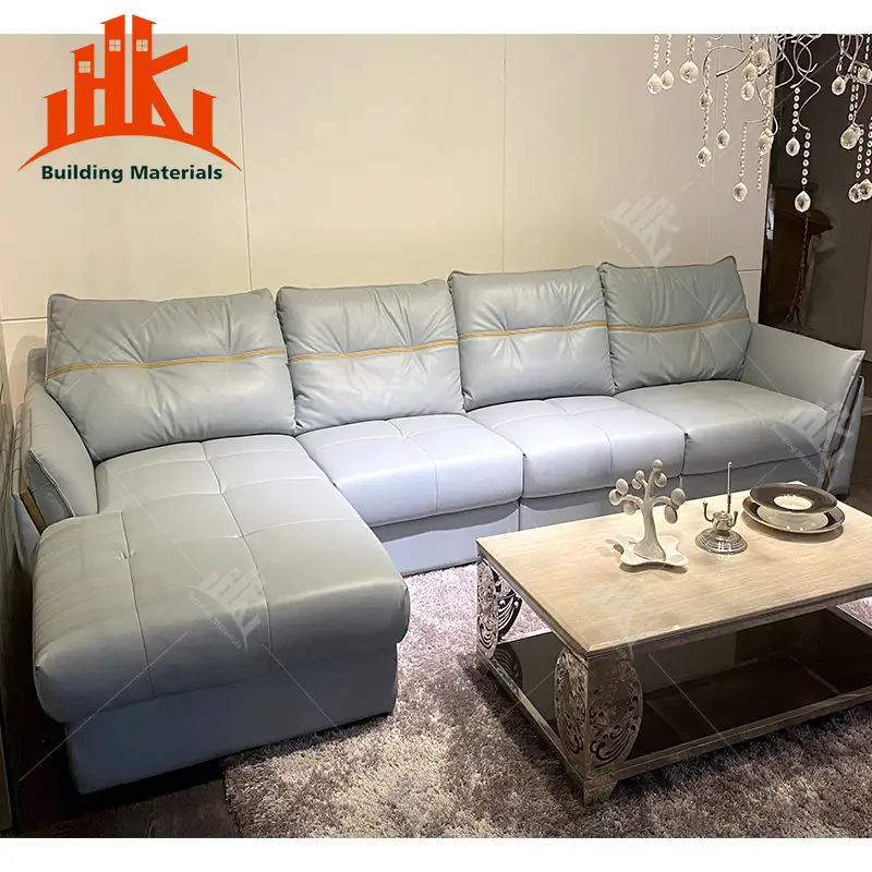 A light gray leather sectional sofa in a modern living room setting.