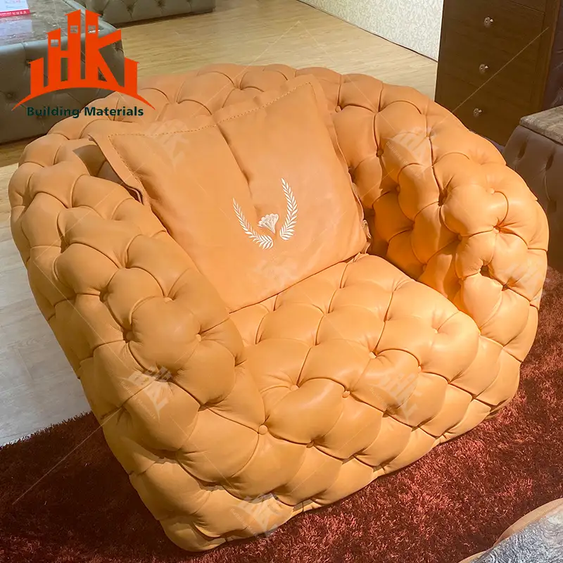Orange tufted floor chair with a cushion