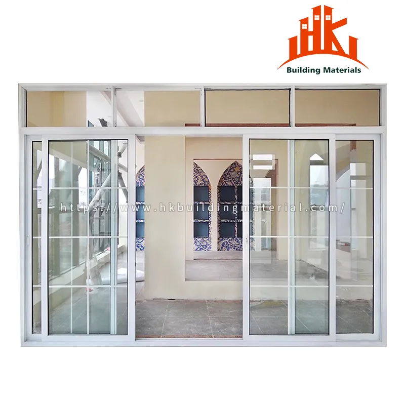 White framed sliding glass doors with grid muntins and transom windows.