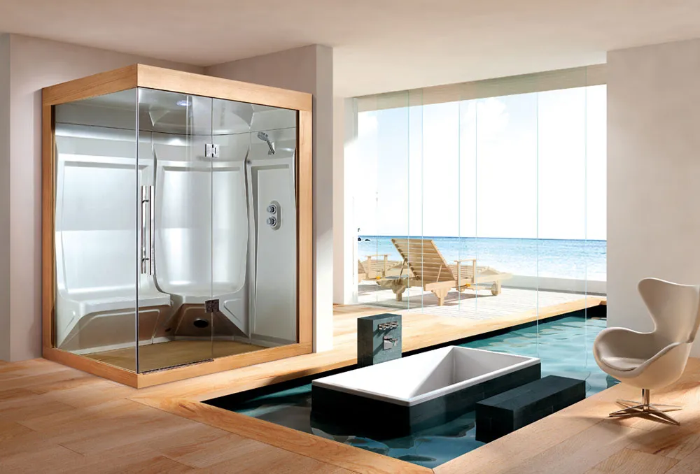 Modern bathroom with glass shower enclosure and indoor pool overlooking the ocean