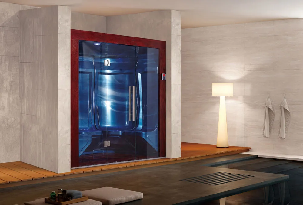 A modern spa room featuring a blue-lit glass sauna and a relaxation area with a floor lamp.