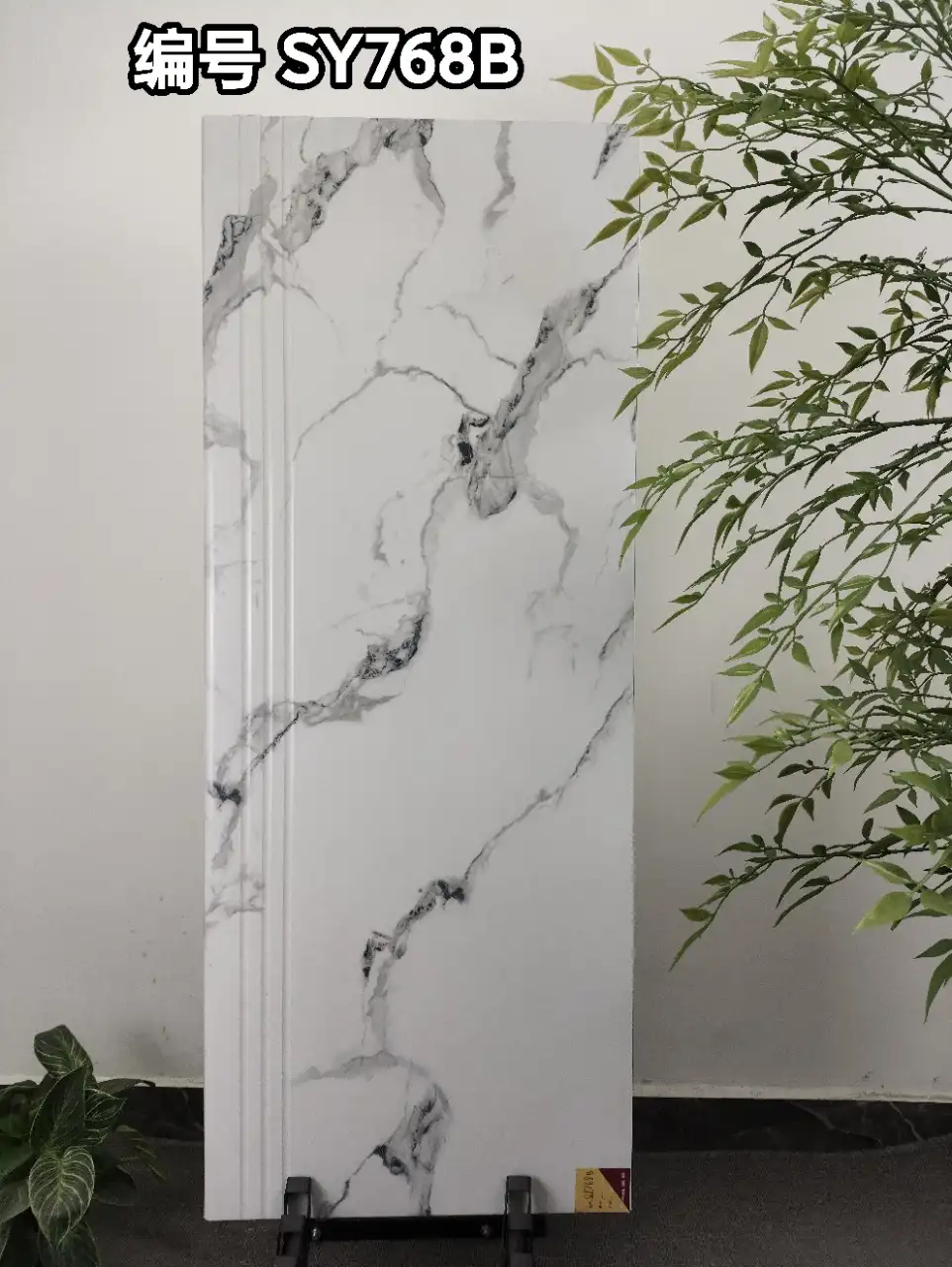 Large white marble-look sintered stone slab with grey veining and fluted edge detail