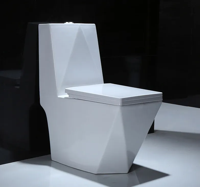 Modern white toilet with a geometric, angular design against a dark background