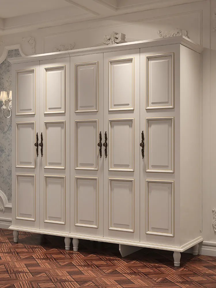 Large white five-door wardrobe with raised panel doors and dark handles in a room.