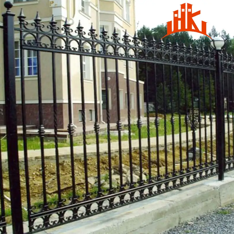 Ornate black metal fence with decorative spear tips and scrollwork