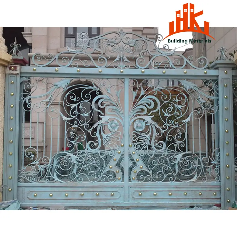 Ornate double-swing gate featuring scrollwork, floral motifs, and gold studs