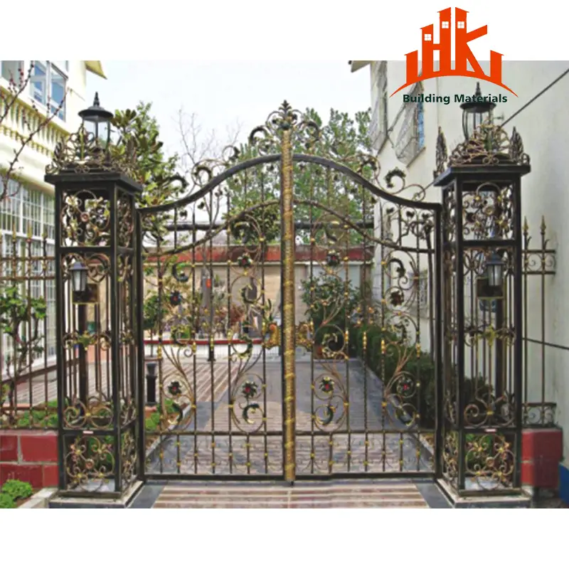 Ornate black and gold metal gate with matching pillars and lanterns at a driveway entrance