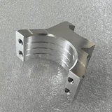 Machined aluminium split tube clamp with a slotted body and side fixing holes
