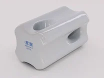 Glossy white glazed ceramic part with two through-h