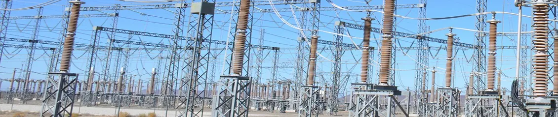 Outdoor substation yard with rows of brown porcelain post insulators supporting busbars