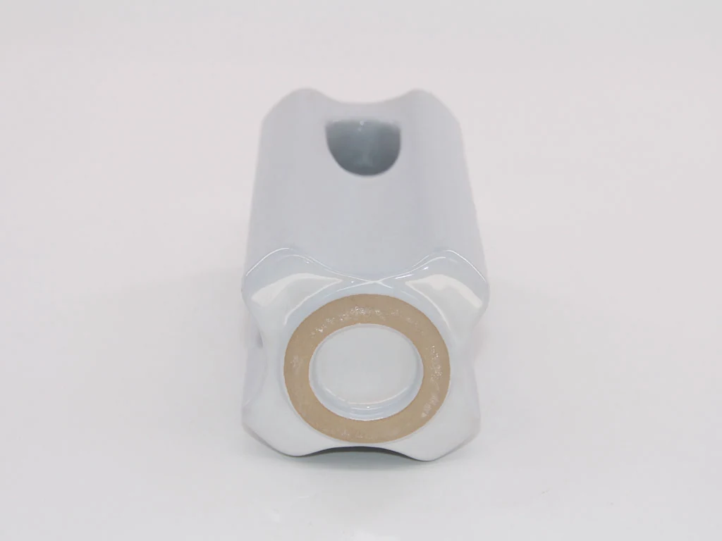 Underside of an ANSI 54-3 porcelain strain insulator showing the cemented metal cap and stud