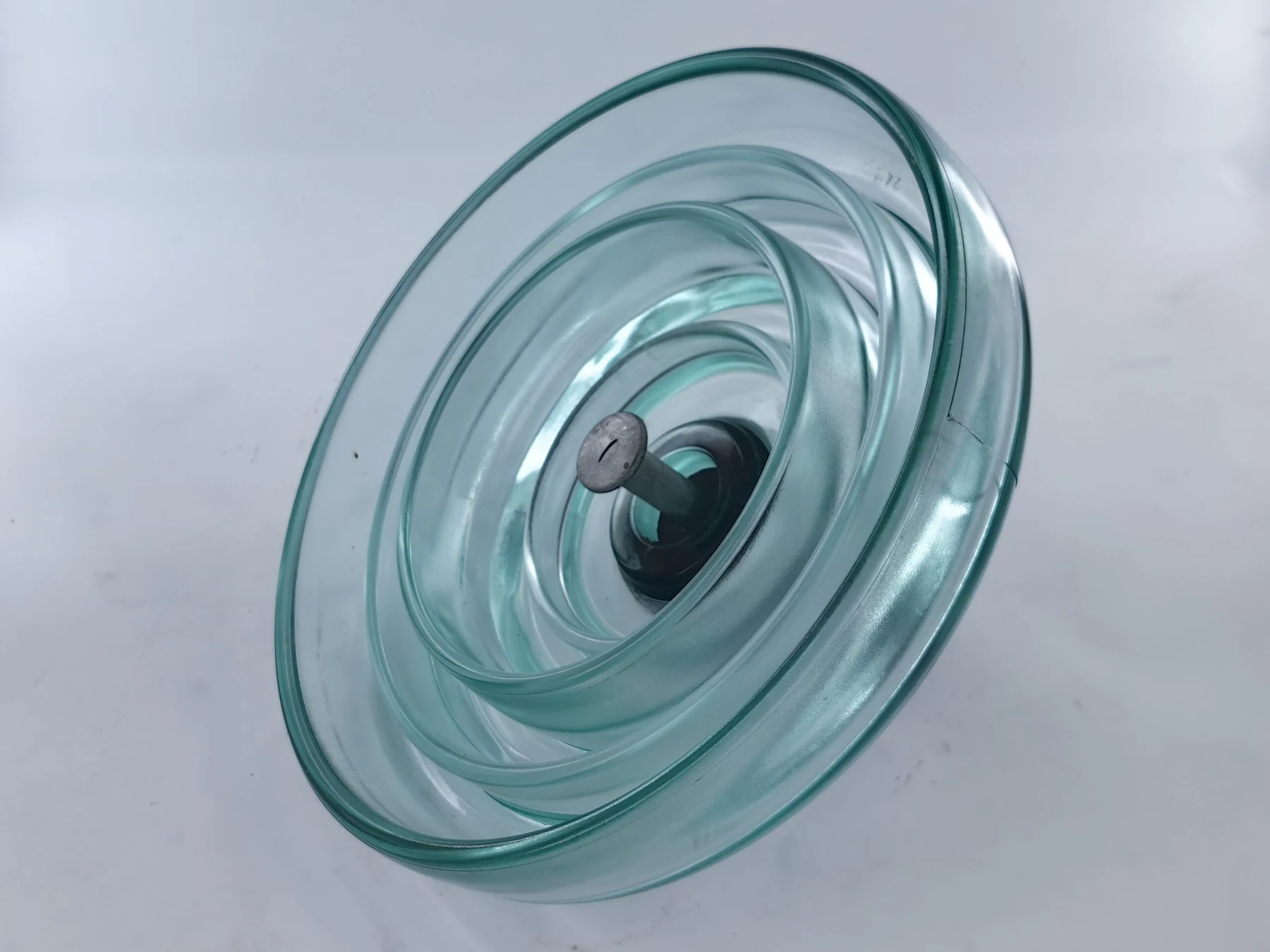 Fog type toughened glass insulator with deep bell profile for polluted environments