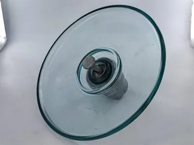 Aerodynamic type glass insulator with wide open shed for desert transmission lines