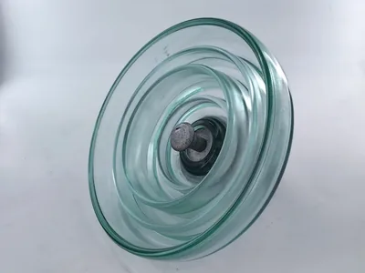 Fog type toughened glass insulator viewed from below showing deep anti-pollution sheds