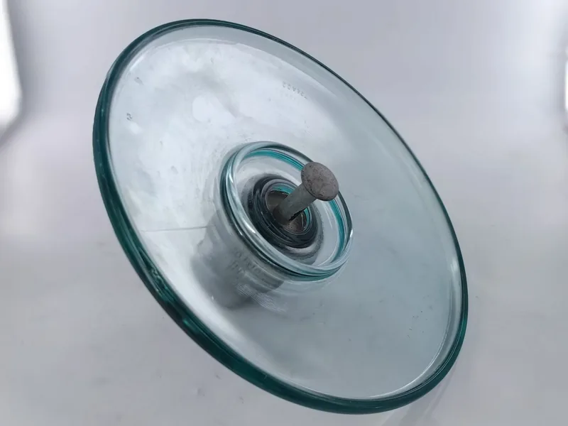 Aerodynamic type toughened glass insulator viewed from above showing the open shed with no underribs