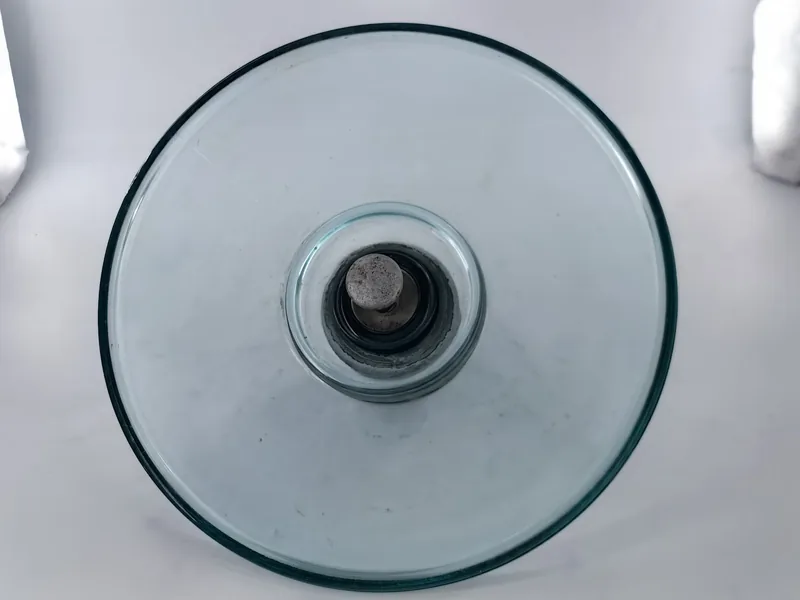Aerodynamic type toughened glass insulator with ball and socket coupling