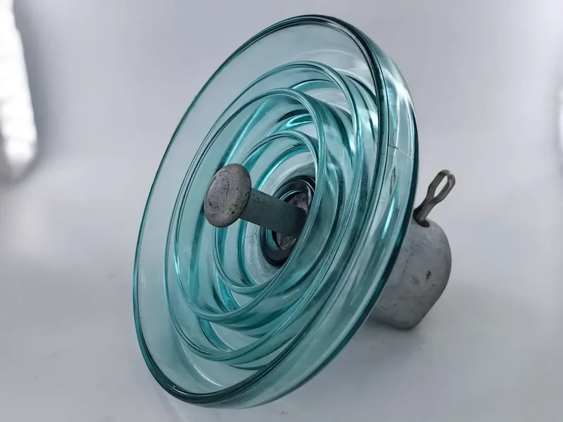 U500B glass insulator showing ribbed underside and cement line