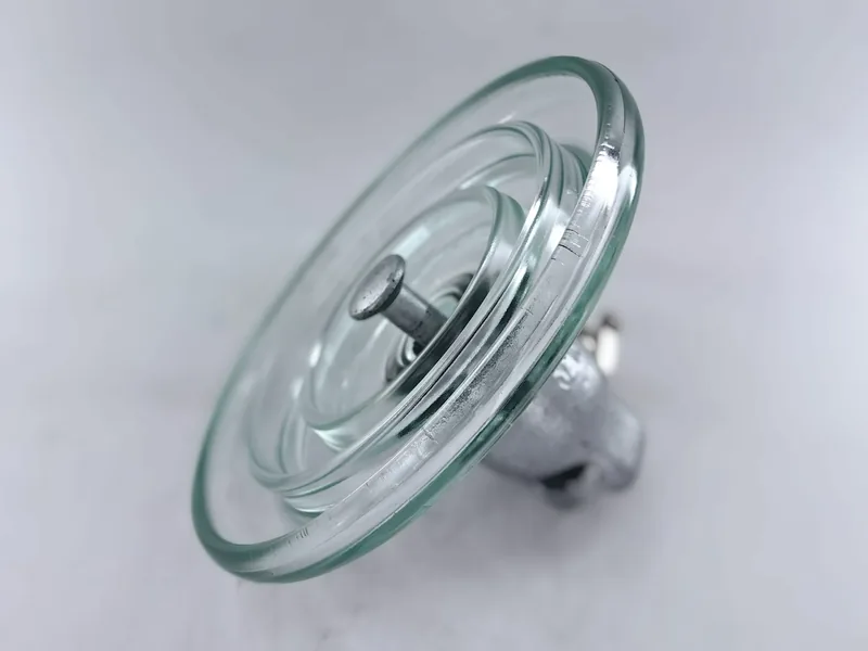 Standard type U70B toughened glass suspension insulator seen from a low angle