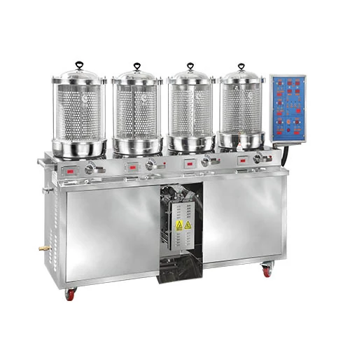 Front angle view of Huayan HYS22X herb decoction and packing machine with four glass pots and integrated liquid pouch sealer