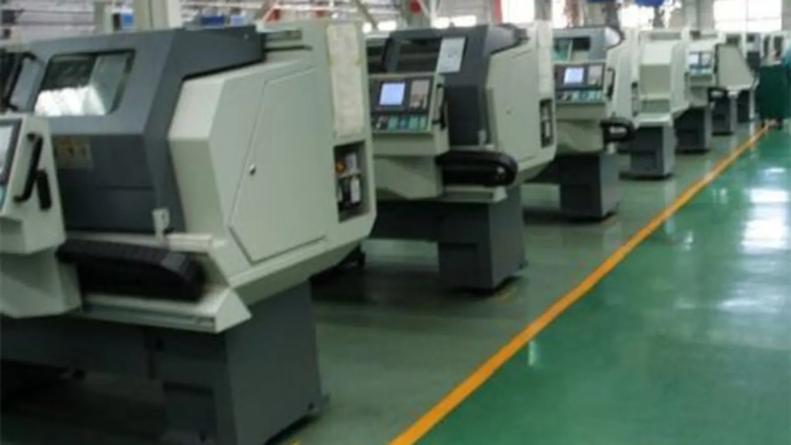 Line of CNC machine tools on the production floor at the Huayan Medical plant in Tianjin