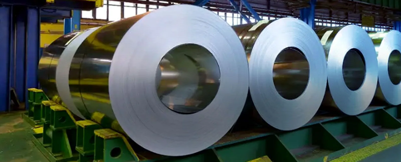 Cold rolled steel coils stored on saddles in a coil bay