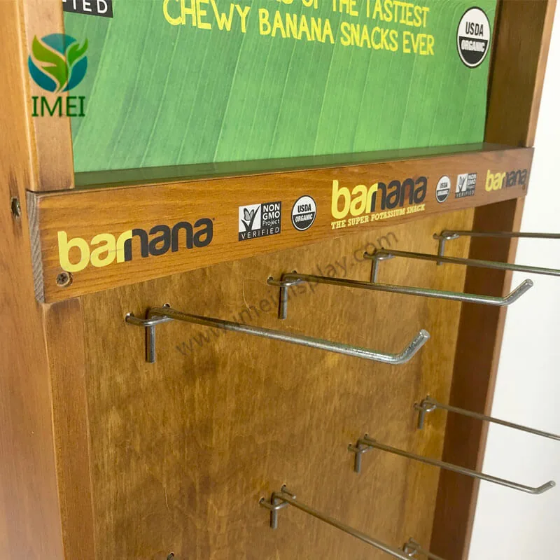 Close view of a mixed wood and metal retail display with steel product hooks