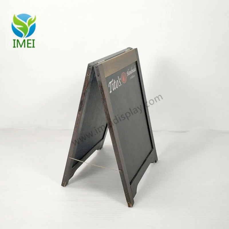 Close view of the printed brand panel on a wooden A-frame chalkboard