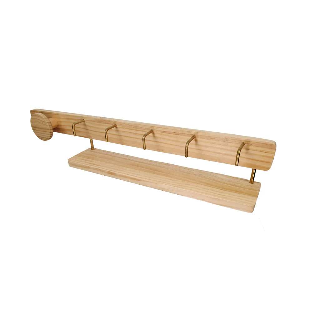 Wall-mounted clothes rack mounted on a white wall in a commercial entryway