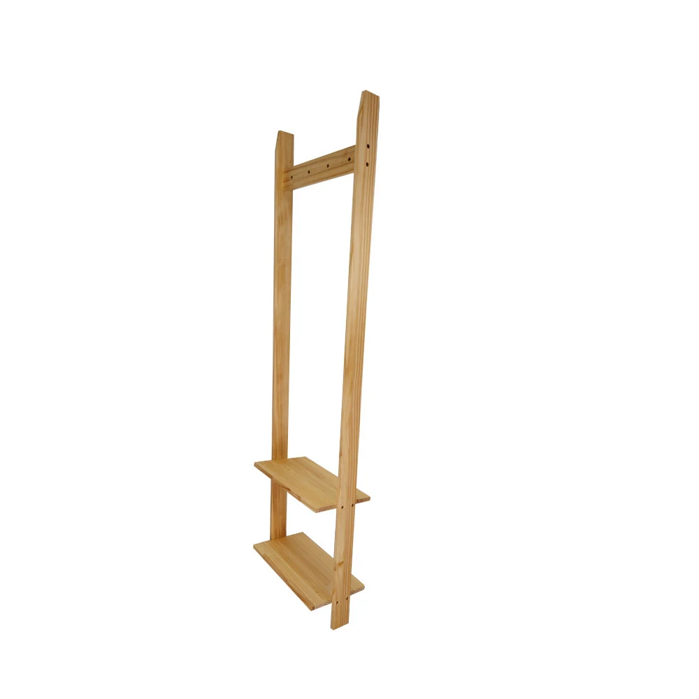 Freestanding clothes rack made from sustainable wood standing upright in a retail workshop