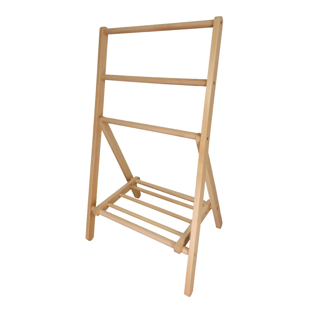 Freestanding clothes rack standing upright in a modern room setting