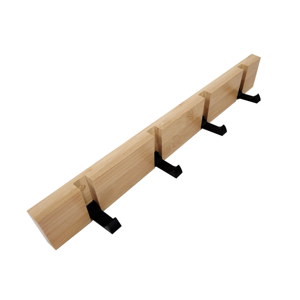 Wall-mounted clothes rack with retractable hooks in a retail environment