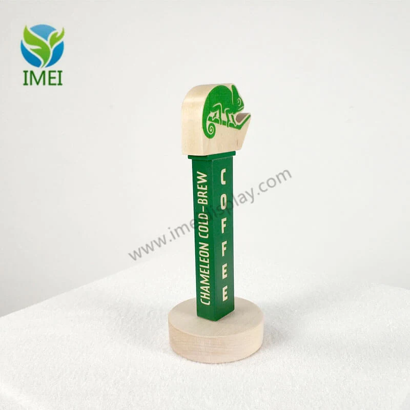 Wood tap handle shown in profile with engraved logo and routed detail