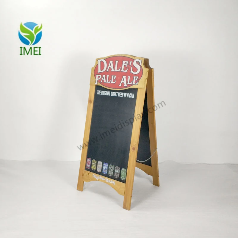 Wooden A-frame chalkboard display standing open on a workshop floor