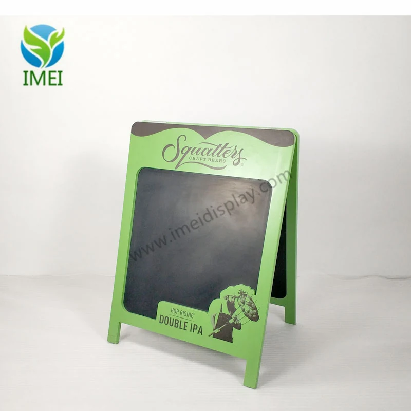 Double-sided wooden A-frame chalkboard standing open on a workshop floor