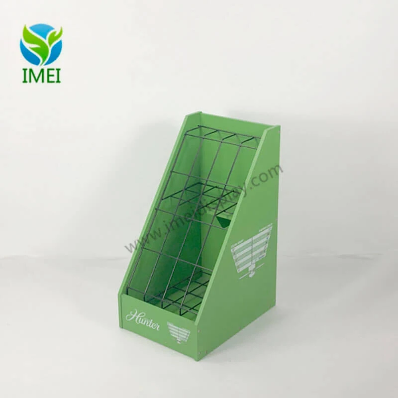 Green wooden and wire fan sales stand standing upright in a retail setting