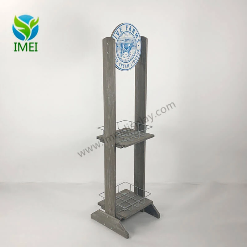 Wooden display with washed white finish and metal wire elements standing upright in a workshop