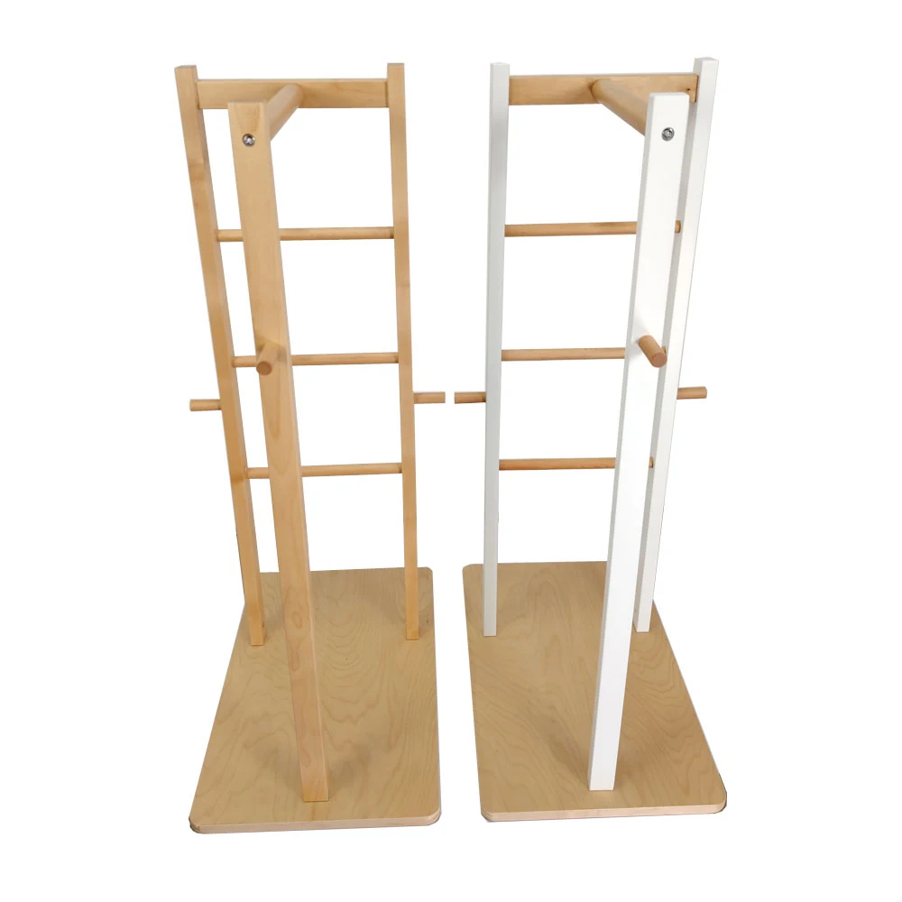Wooden clothing shelf standing upright in a retail setting, showing open shelving structure