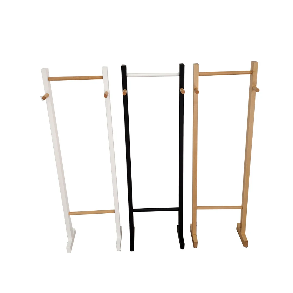 Custom mixed-material umbrella rack standing upright in a residential entryway