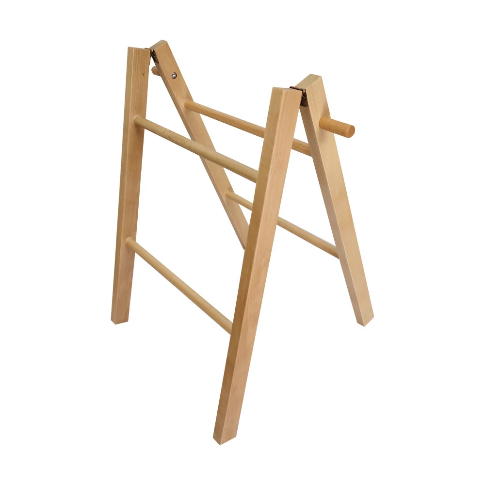 Mixed-material display rack with polished finish standing upright in a workshop