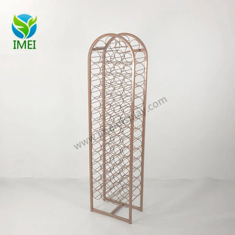 Metal bottle display for Tito’s Golden standing upright in a retail setting