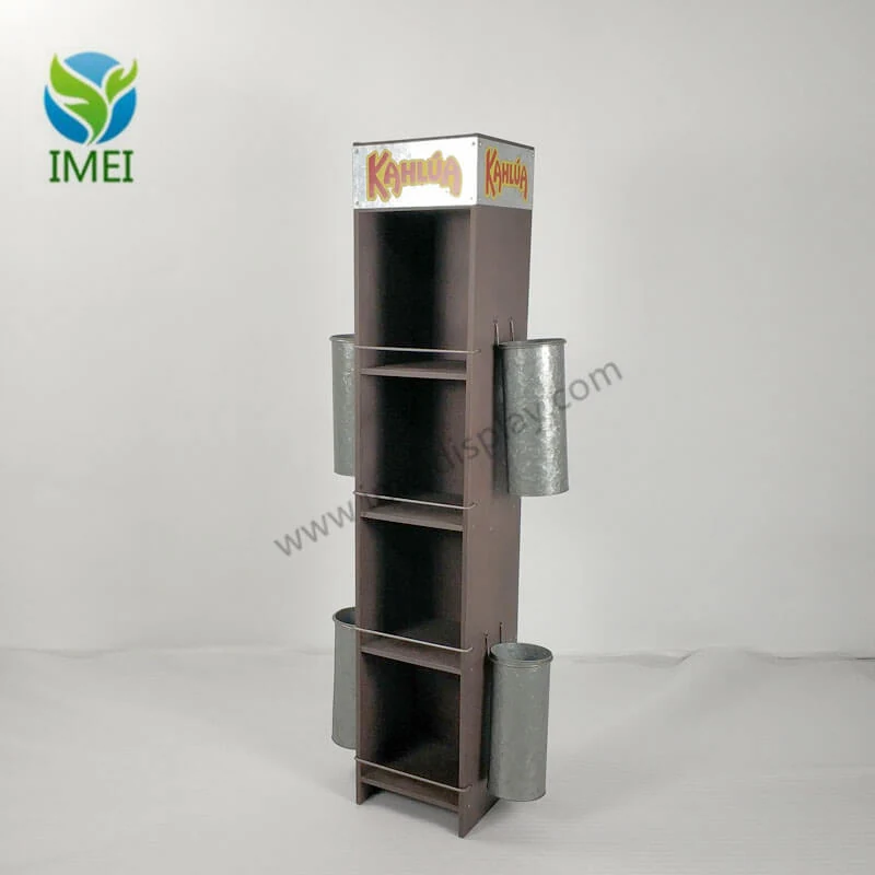 Wooden and metal vase with aged finish displayed upright in a workshop