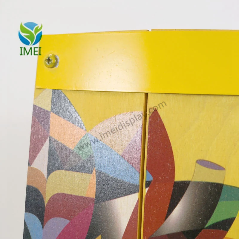 Detail of a four-colour printed graphic panel on a custom wooden barrel display