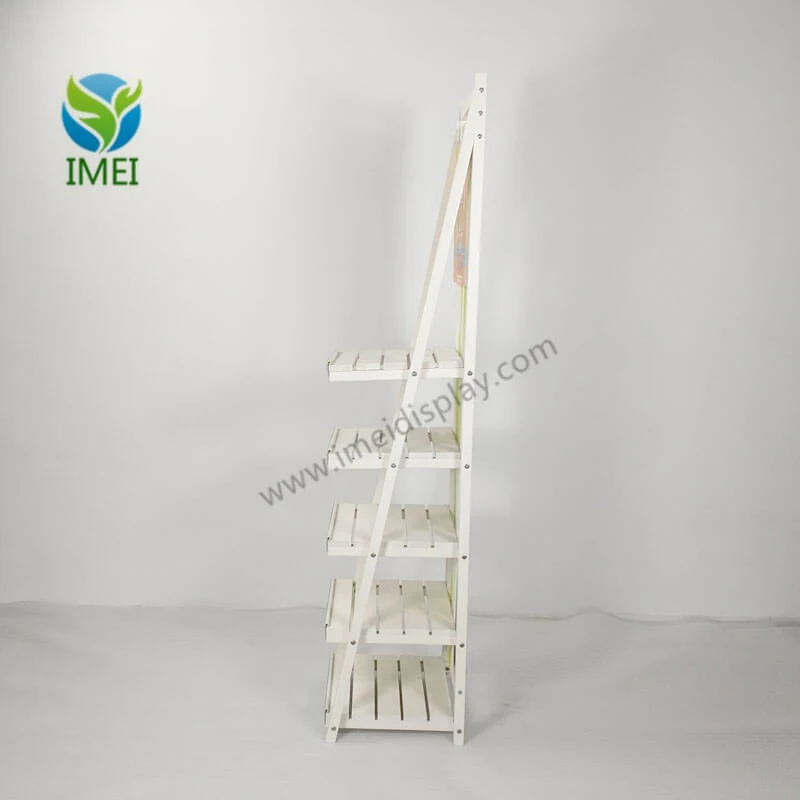 Side view of wooden floor display showing shelf structure and fabric application